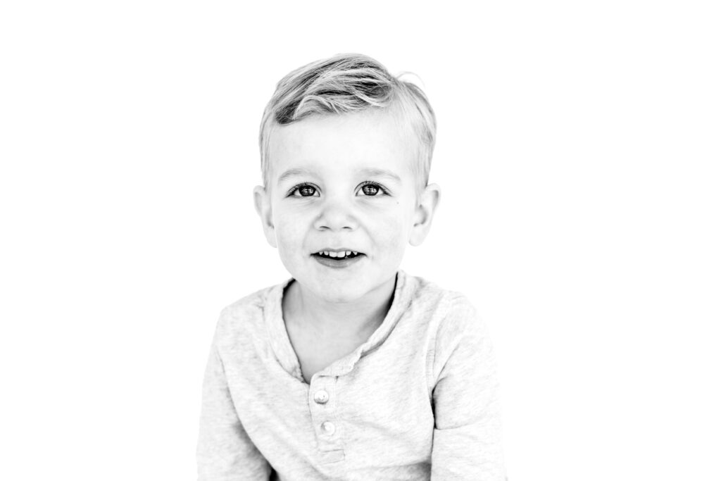 Black and white personality portrait of a pre school aged child in the Boston suburbs.