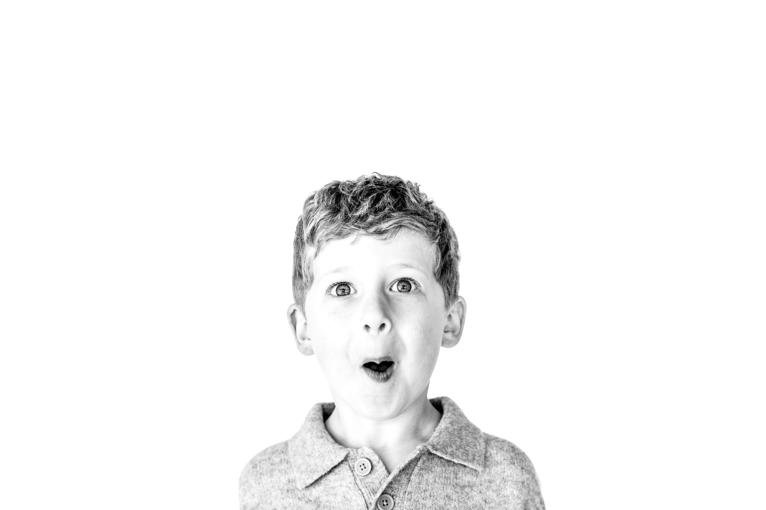 Black and white personality portrait session of a child showing natural expression of his personality