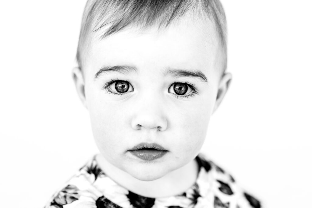 Black and white personality portrait of a child with a natural expression
